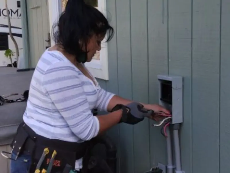 Licensed electrician wiring an exterior subpanel in Lowesville
